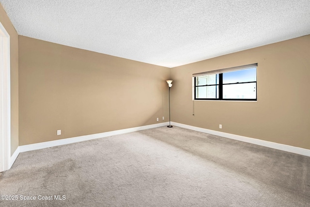 520 Palm Springs Blvd Unit 405, Indian Harbour Beach, FL 32937 - unfurnished room with carpet flooring and a textured ceiling