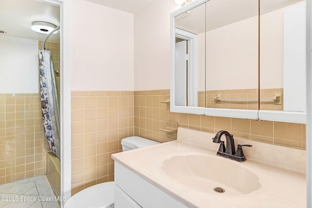520 Palm Springs Blvd Unit 405, Indian Harbour Beach, FL 32937 - bathroom with vanity, tile walls, shower / tub combo with curtain, and wainscoting