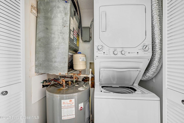 520 Palm Springs Blvd Unit 405, Indian Harbour Beach, FL 32937 - laundry area with water heater and stacked washing machine and dryer