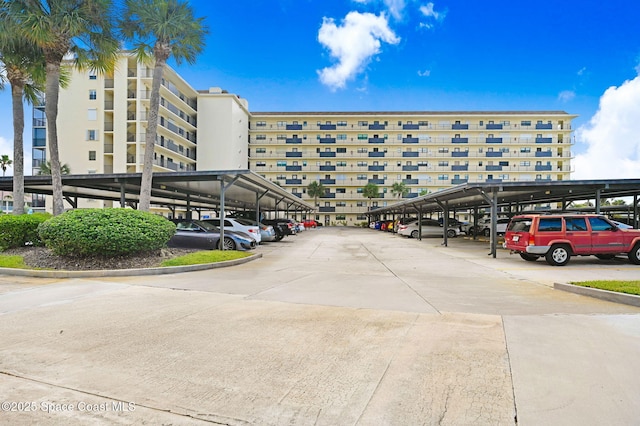520 Palm Springs Blvd Unit 405, Indian Harbour Beach, FL 32937 - view of apartment building / complex with covered parking