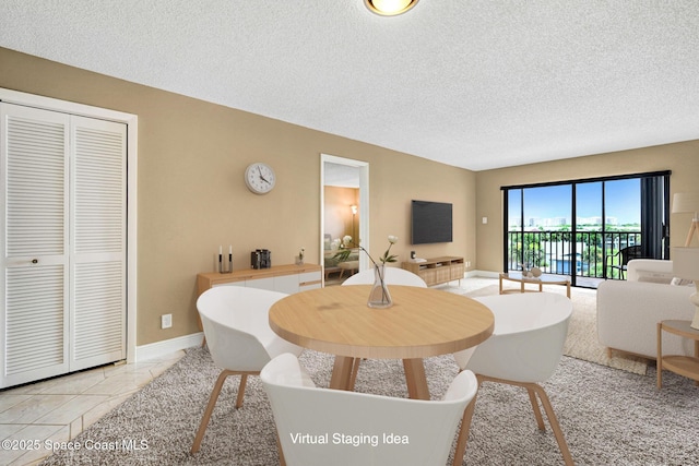 520 Palm Springs Blvd Unit 405, Indian Harbour Beach, FL 32937 - dining space featuring a textured ceiling