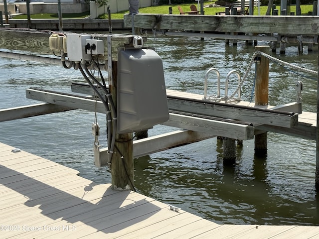55 Country Club Rd, Cocoa Beach, FL 32931 - dock area featuring boat lift and a water view
