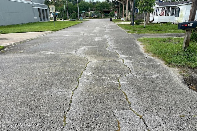 250 Willow Pl, Ormond Beach, FL 32174 - view of asphalt street featuring traffic signs