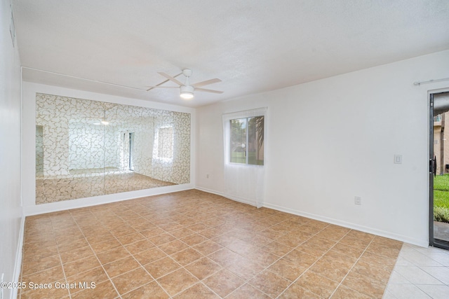 128 San Paulo Cir Unit 128, West Melbourne, FL 32904 - spare room with ceiling fan, healthy amount of natural light, and light tile patterned floors