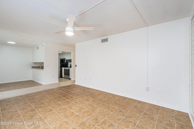 128 San Paulo Cir Unit 128, West Melbourne, FL 32904 - unfurnished room with ceiling fan and baseboards
