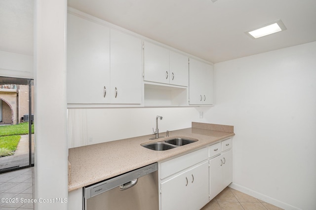 128 San Paulo Cir Unit 128, West Melbourne, FL 32904 - kitchen with stainless steel dishwasher, light tile patterned floors, white cabinets, and light stone counters