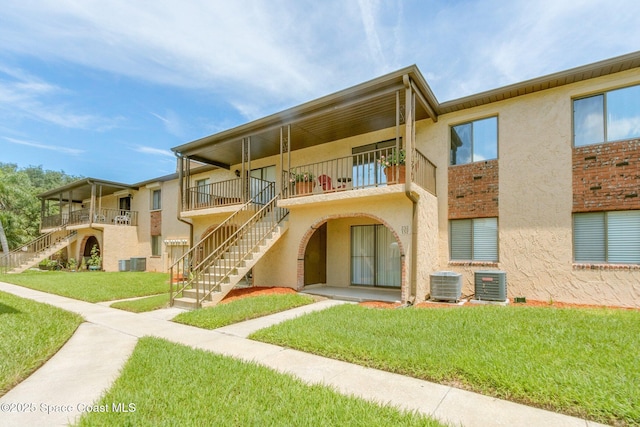 128 San Paulo Cir Unit 128, West Melbourne, FL 32904 - view of property featuring stairway