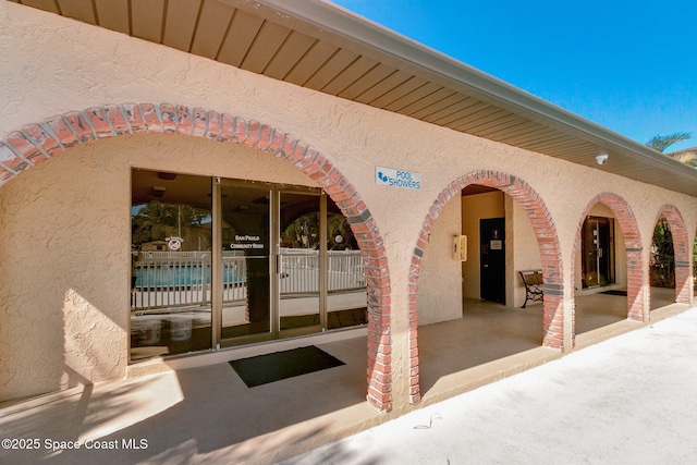 128 San Paulo Cir Unit 128, West Melbourne, FL 32904 - property entrance with stucco siding