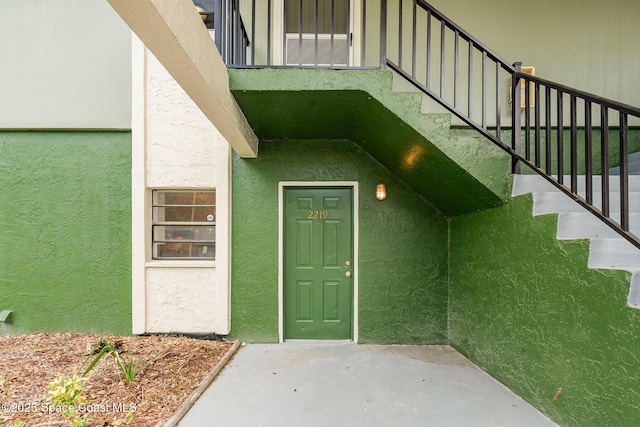 2219 Flower Tree Cir, Melbourne, FL 32935 - property entrance featuring stucco siding