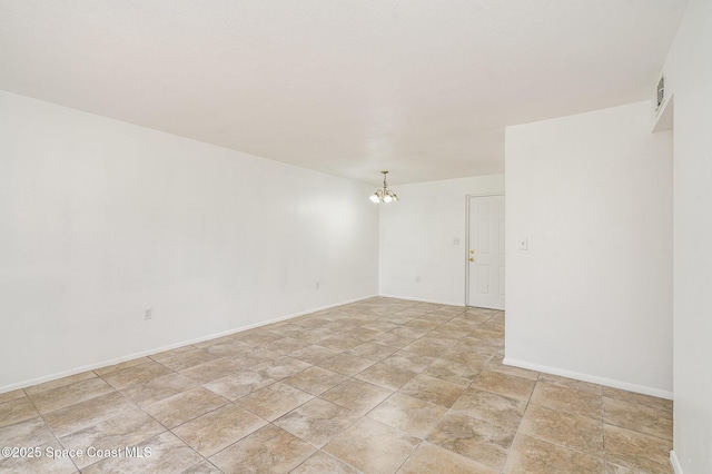 2219 Flower Tree Cir, Melbourne, FL 32935 - spare room featuring a chandelier and light stone finish flooring
