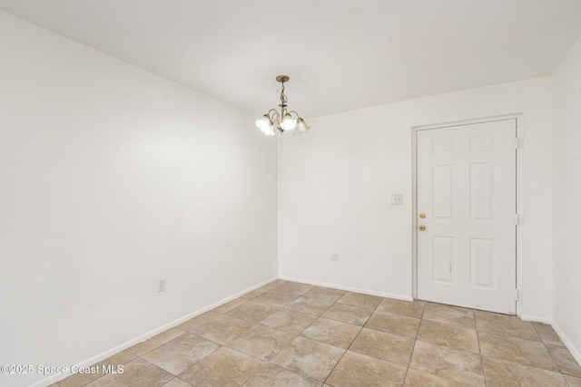 2219 Flower Tree Cir, Melbourne, FL 32935 - empty room featuring a chandelier and baseboards