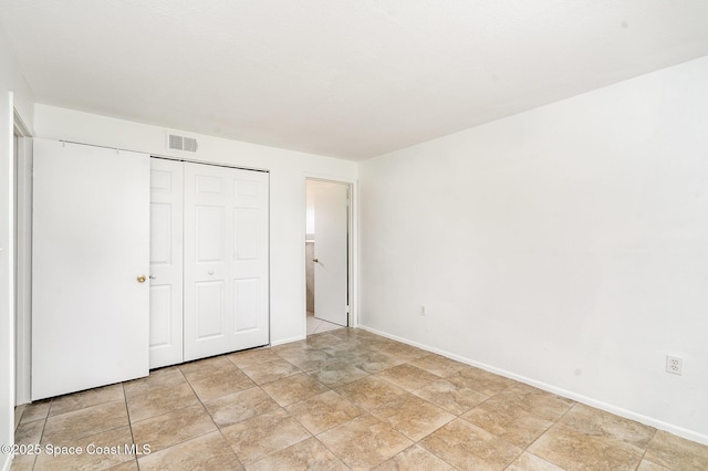 2219 Flower Tree Cir, Melbourne, FL 32935 - unfurnished bedroom featuring baseboards and a closet