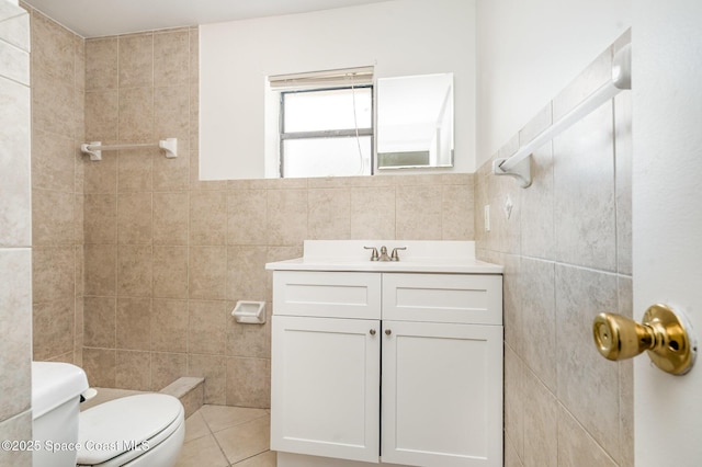 2219 Flower Tree Cir, Melbourne, FL 32935 - bathroom featuring tile walls, vanity, and tile patterned flooring