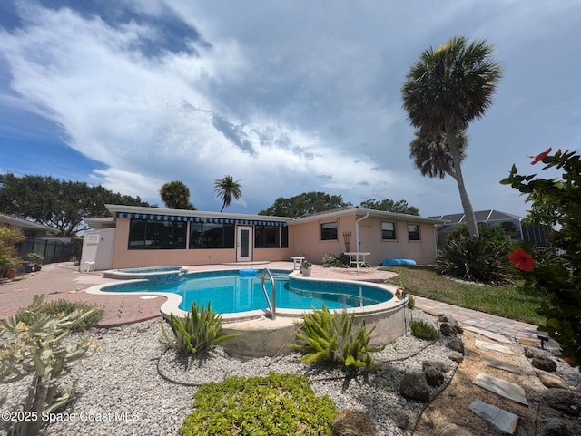 63 Yacht Haven Dr, Cocoa Beach, FL 32931 - view of swimming pool with a patio area and a pool with connected hot tub