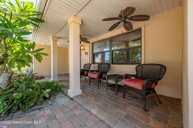 63 Yacht Haven Dr, Cocoa Beach, FL 32931 - covered porch featuring a ceiling fan