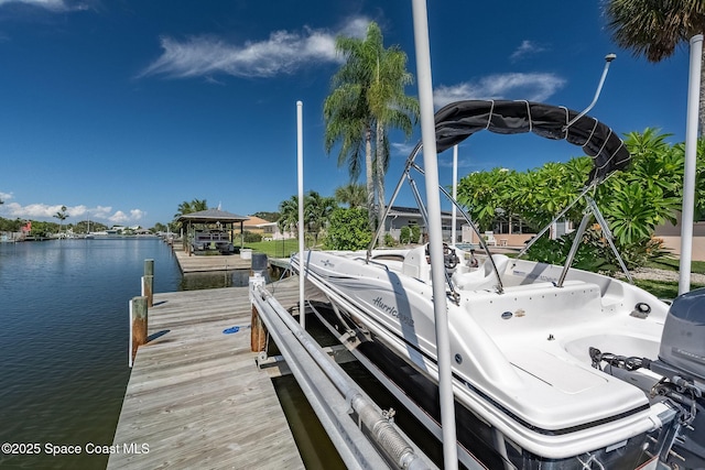 63 Yacht Haven Dr, Cocoa Beach, FL 32931 - dock featuring a water view and boat lift
