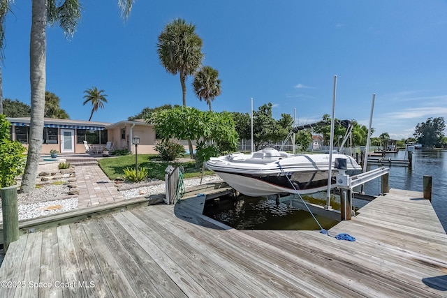 63 Yacht Haven Dr, Cocoa Beach, FL 32931 - dock area featuring boat lift and a water view