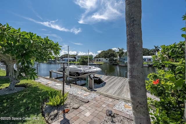 63 Yacht Haven Dr, Cocoa Beach, FL 32931 - dock area with boat lift and a water view