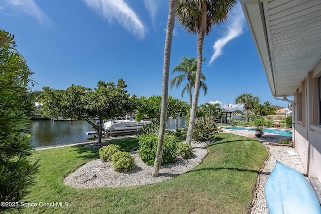 63 Yacht Haven Dr, Cocoa Beach, FL 32931 - view of grassy yard with a water view