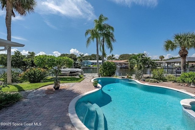 63 Yacht Haven Dr, Cocoa Beach, FL 32931 - view of swimming pool featuring a pool with connected hot tub and a water view