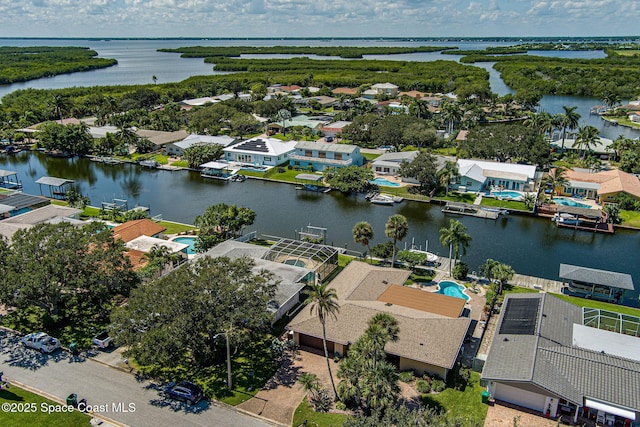 63 Yacht Haven Dr, Cocoa Beach, FL 32931 - aerial view of residential area featuring a large body of water