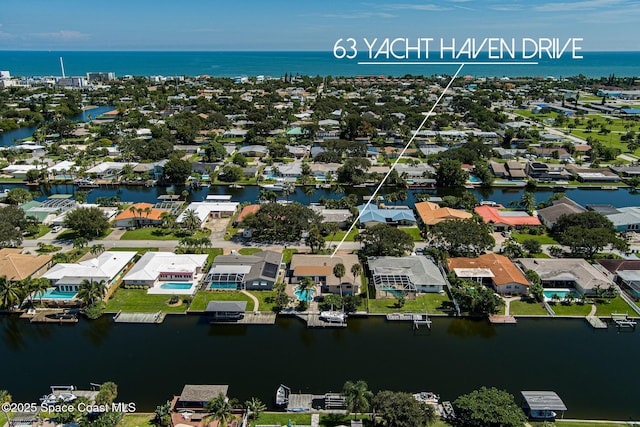 63 Yacht Haven Dr, Cocoa Beach, FL 32931 - aerial view of residential area featuring a nearby body of water