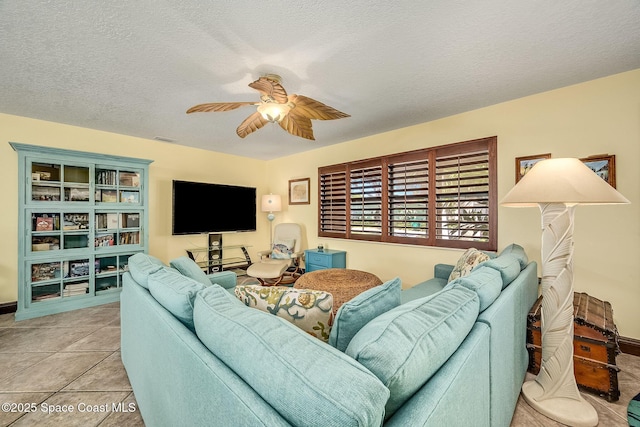 63 Yacht Haven Dr, Cocoa Beach, FL 32931 - living room featuring a ceiling fan, light tile patterned floors, and a textured ceiling