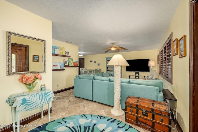 63 Yacht Haven Dr, Cocoa Beach, FL 32931 - living room with a ceiling fan, a textured ceiling, and tile patterned floors