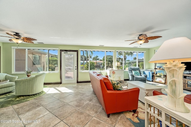 63 Yacht Haven Dr, Cocoa Beach, FL 32931 - living area with a ceiling fan and light tile patterned floors