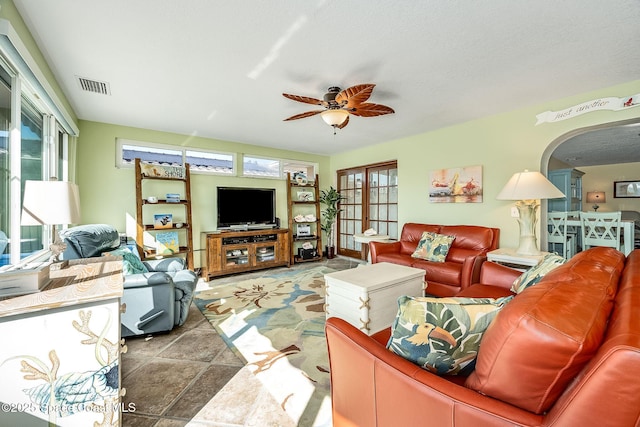 63 Yacht Haven Dr, Cocoa Beach, FL 32931 - living area with ceiling fan and arched walkways