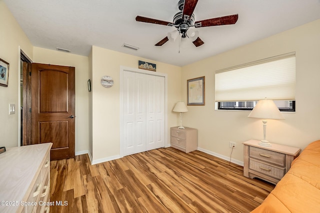 63 Yacht Haven Dr, Cocoa Beach, FL 32931 - bedroom featuring a closet, light wood-type flooring, and ceiling fan