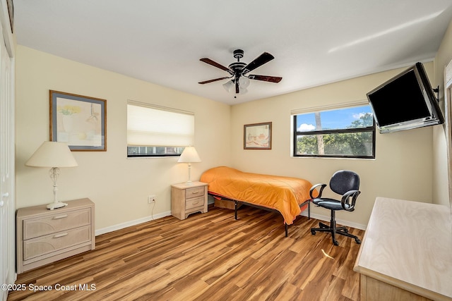 63 Yacht Haven Dr, Cocoa Beach, FL 32931 - bedroom featuring wood finished floors and a ceiling fan
