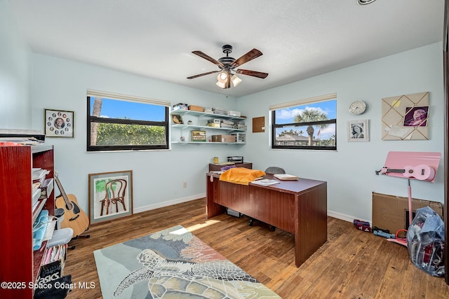 63 Yacht Haven Dr, Cocoa Beach, FL 32931 - office area with a ceiling fan and wood finished floors