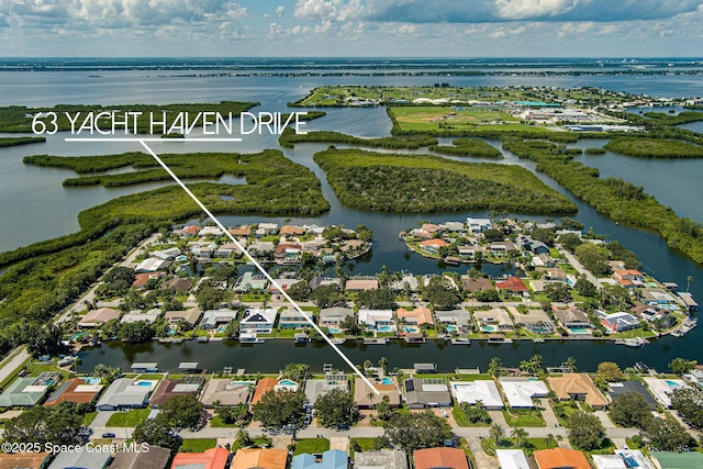 63 Yacht Haven Dr, Cocoa Beach, FL 32931 - aerial view of residential area featuring a nearby body of water