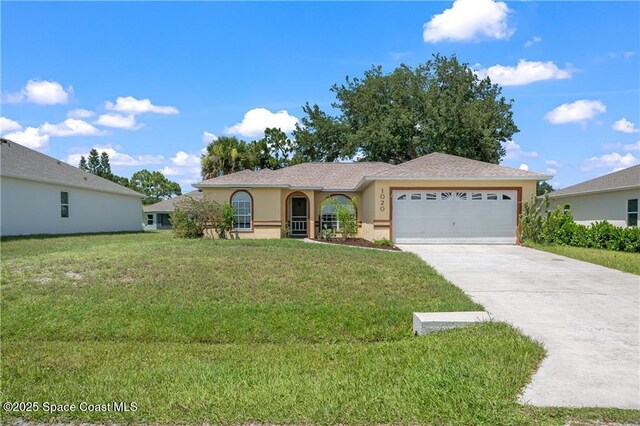 1020 Seamist Ln, Sebastian, FL 32958 - single story home with an attached garage, stucco siding, concrete driveway, and a front lawn