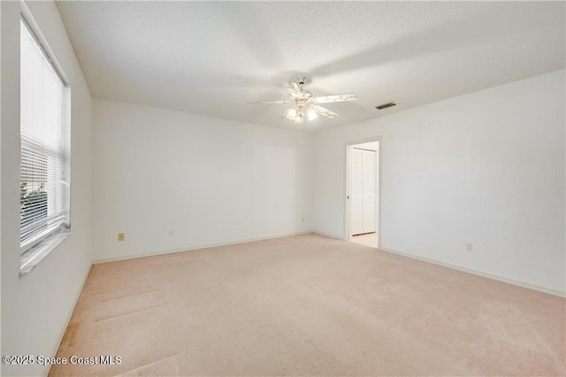 1020 Seamist Ln, Sebastian, FL 32958 - spare room with light carpet and a ceiling fan
