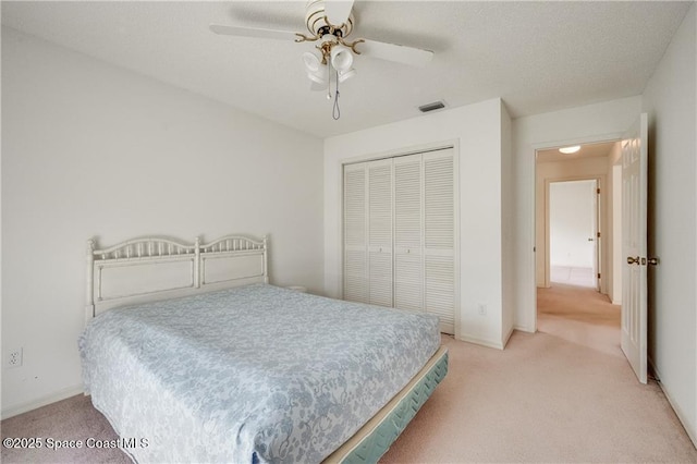 1020 Seamist Ln, Sebastian, FL 32958 - bedroom featuring light colored carpet, a closet, and ceiling fan