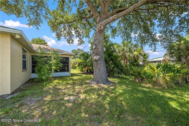 1020 Seamist Ln, Sebastian, FL 32958 - view of grassy yard featuring a sunroom