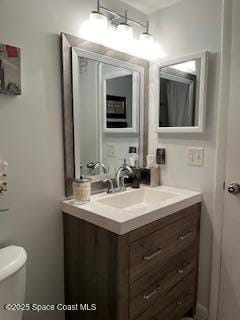 300 Columbia Dr Unit 206-1, Cape Canaveral, FL 32920 - half bathroom featuring vanity and toilet