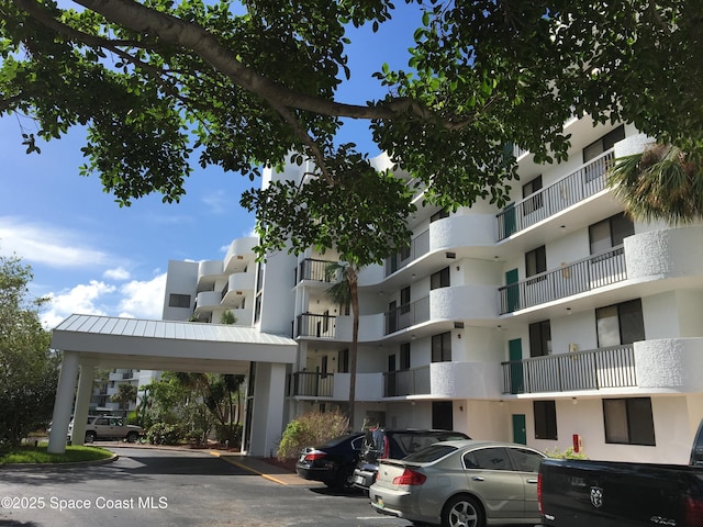 300 Columbia Dr Unit 206-1, Cape Canaveral, FL 32920 - view of apartment building / complex with uncovered parking