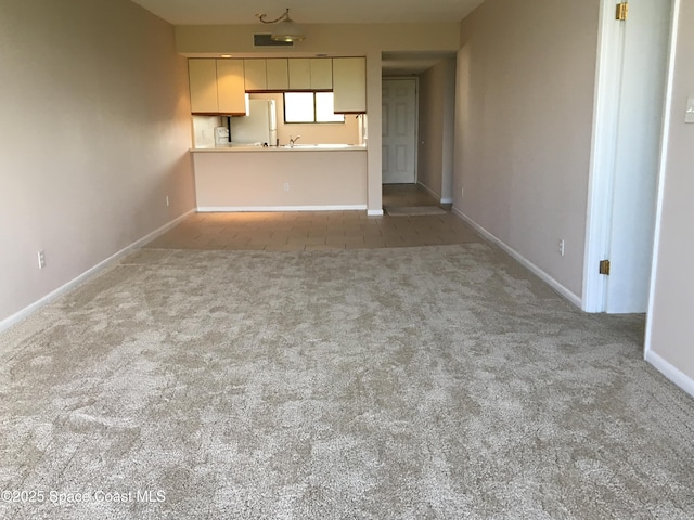 300 Columbia Dr Unit 206-1, Cape Canaveral, FL 32920 - unfurnished living room with carpet flooring and baseboards