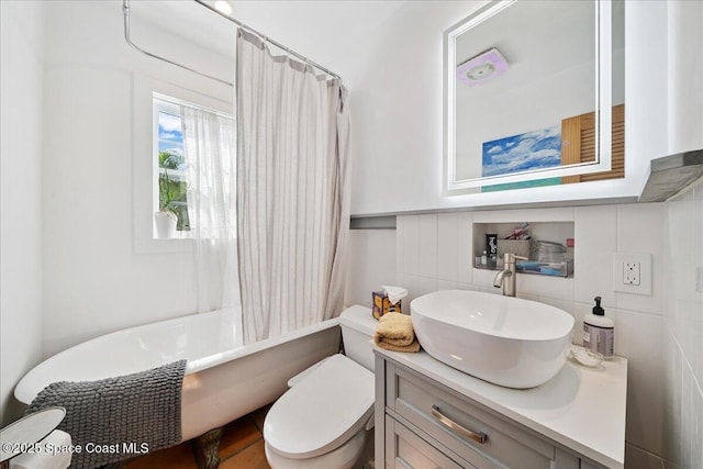 2314 Post Rd, Melbourne, FL 32935 - bathroom with vanity, tile walls, and shower / tub combo