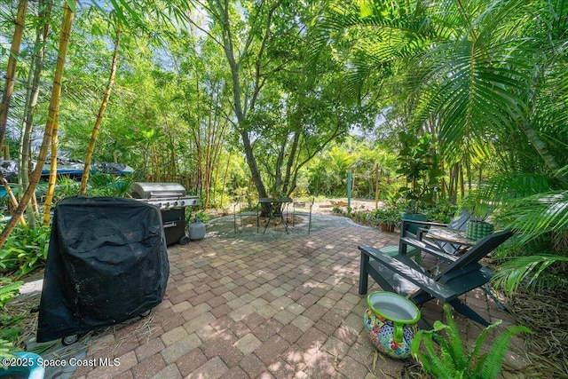 2314 Post Rd, Melbourne, FL 32935 - view of patio / terrace featuring outdoor dining area and a grill