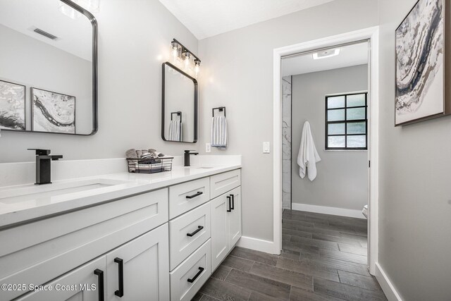127 Friar Ct, Sebastian, FL 32958 - bathroom featuring double vanity and wood finish floors