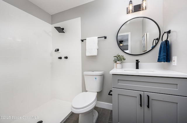 127 Friar Ct, Sebastian, FL 32958 - full bathroom featuring vanity, tiled shower, ceiling fan, and wood finished floors