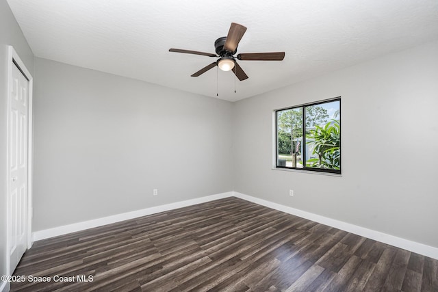 127 Friar Ct, Sebastian, FL 32958 - unfurnished bedroom with dark wood-style flooring, a closet, and a ceiling fan