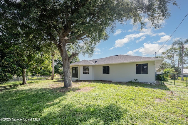 127 Friar Ct, Sebastian, FL 32958 - rear view of house with stucco siding