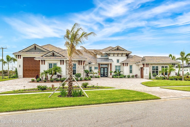 3778 Lake Adelaide Pl, Rockledge, FL 32955 - view of front of home with curved driveway, stucco siding, and french doors
