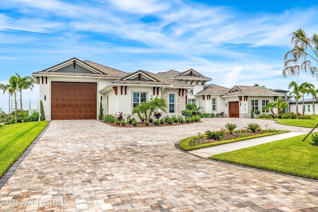 3778 Lake Adelaide Pl, Rockledge, FL 32955 - view of front of home with a garage, stucco siding, and decorative driveway