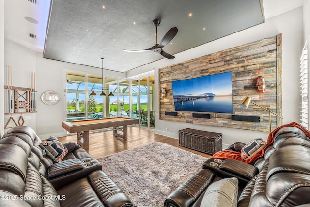3778 Lake Adelaide Pl, Rockledge, FL 32955 - living area with pool table, ceiling fan, wood finished floors, and a textured ceiling